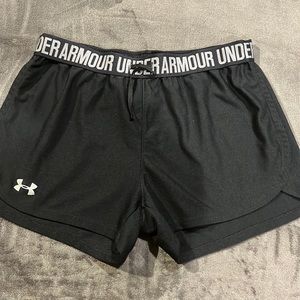 4 pair of women’s medium Under Armour shorts